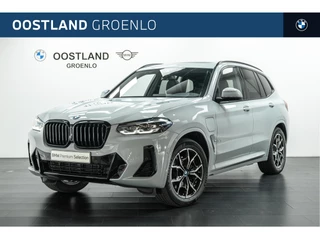 Hoofdafbeelding BMW X3 BMW X3 xDrive30e High Executive M Sport Automaat / Panoramadak / Trekhaak / Sportstoelen / Achteruitrijcamera / Live Cockpit Professional / Stuurverwarming