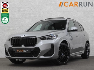 Hoofdafbeelding BMW X1 BMW X1 18i M-Sport | Panorama | Sportstoelen | Keyless-Entry | Sfeerverlichting | Achteruitrij-Camera | 5x op voorraad! | Carplay | Full-LED | Black-Optic | Getint Glas | Stoelverwarming | Draadloos Laden |