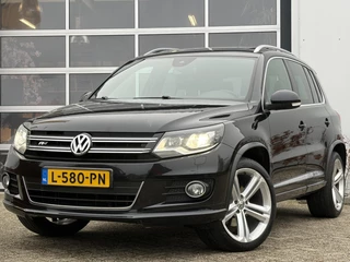 Volkswagen Tiguan 2.0 TSI Sport&Style 4motion R-line Edition 180pk | Achteruitrijcamera | Bi-xenon koplampen | Elektrisch glazen panorama-dak | Lederen interieur | Parkeersensor voor en achter | Voorstoelen verwarmd | Dealer onderhouden!