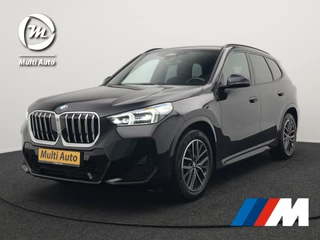 BMW X1 sDrive18i M-Sport Automaat 136pk Dealer O.H. | Trekhaak af Fabriek | Alcantara Sportstoelen Memory & Verwarmd | Camera | Cruise Control | Blis | Park Assist | Apple Carplay | Navigatie | Sfeerverlichting |