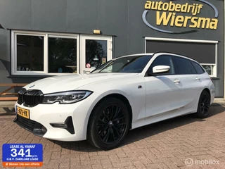 BMW 3-serie Touring 330i Business Edition M-Pakket Electrische trekhaak 258PK dealer onderhouden