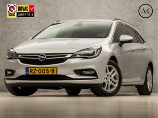 Opel Astra Sports Tourer 1.0 Sport (APPLE CARPLAY, GROOT NAVI, CRUISE, GETINT GLAS, SPORTSTOELEN, PARKEERSENSOREN, DAB+, TREKHAAK, ELEK PAKKET, NIEUWE APK, NIEUWSTAAT)