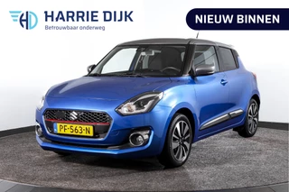 Hoofdafbeelding Suzuki Swift Suzuki Swift 1.0 Stijl 115 PK Smart Hybrid | Adapt. Cruise |Stoelverw. | Camera | NAV + App. Connect | ECC | Afn. Trekhaak | LM 16" |