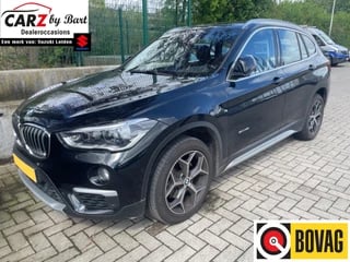 BMW X1 sDRIVE18i CENTENNIAL EXECUTIVE AUT. Leder | Navi | 18" Lichtmetalen velgen