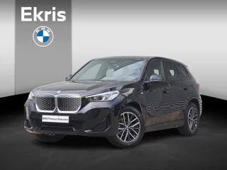 BMW iX1 eDrive20 | M Sportpakket | Panodak | Trekhaak | Getint Glas | Camera | Sportstoelen | Adaptief Onderstel | 18'' LMV
