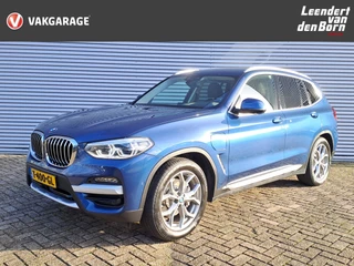 Hoofdafbeelding BMW X3 BMW X3 xDrive30e eDrive Edition PHEV AUTOMAAT Trekhaak | Stuur en stoelverwarming | Digitaal cockpit | Climate | Cruise | HUD | Elektr. Achterklep | 19 INCH L.M. velgen