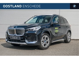 Hoofdafbeelding BMW iX1 BMW iX1 eDrive20 xLine / Panoramadak / Trekhaak / Parking Assistant / Stoelverwarming / Harman-Kardon