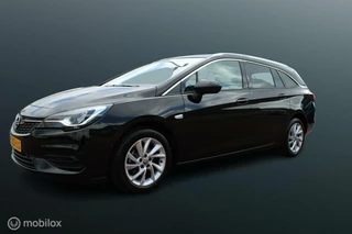 Hoofdafbeelding Opel Astra Opel Astra Sports Tourer 1.2 Business Elegance 145 PK, Pdc voor/achter + Camera, App connect, Cruise, Clima, Navi, Donkerglas, Full led, Comfort stoelen, Dode hoek detectie, Lmv 16 inch.