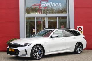 BMW 3-Serie Touring 330e 292PK M-SPORT | PANORAMISCH SCHUIF/KANTEL DAK | M-SPORT PRO-PAKKET | M-SPORT REMMEN UITGEVOERD IN DONKERBLAUW MET M LOGO | BMW LIVE COCKPIT PROFESSIONAL | CURVED DISPLAY |DRIVING ASSISTANT INCL. HEAD-UP DISPLAY | PARKING ASSIST INCL. ACHTERUITRIJCAMERA | ADAPTIEVE LED KOPLAMPEN |SHADOW LINE | M-SPORTSTOELEN VOOR | LEDER VERNASCA MET CONTRAST STIKSELS M-SPORT | STOEL VERWARMING | DRAADLOZE APPLE CARPLAY | ELEKTRISCH VERSTELBARE STOELEN MET GEHEUGEN FUNCTIE | HEAD UP DISPLAY | DRAADLOZE TELEFOONLADER | DODEHOEK BEWAKING | COMFORT PACK INCL. ELEKTRISCHE ACHTERKLEP | ADAPTIVE CRUISE CONTROL | HIFI AUDIO DAB+ RADIO | COMFORT ACCESS (KEYLESS ENTRY)| DONKER GETINTE ACHTERRUITEN |