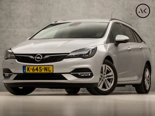 Hoofdafbeelding Opel Astra Opel Astra Sports Tourer 1.4 Sport 146Pk Automaat (APPLE CARPLAY, NAVIGATIE, CLIMATE, CAMERA, GETINT GLAS, SPORTSTOELEN, LM VELGEN, PARKEERSENSOREN, CRUISE, NIEUWSTAAT)