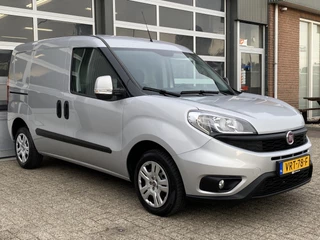 Hoofdafbeelding Fiat Doblò Fiat Doblò Cargo 1.3 MJ L1H1 SX 90pk Btw en Bpm vrij Airco Cruise controle Navigatie Tussenschot Parkeerhulp achter 1e eigenaar Ex overheid Euro 5 Marge