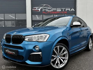 Hoofdafbeelding BMW X4 BMW X4 M40i High Executive Pano H&K Trekhk Maxton Head-Up Vol!