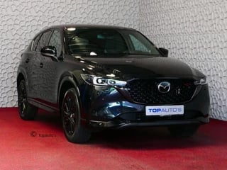 Hoofdafbeelding Mazda CX-5 Mazda CX-5 E-SKYACTIV MHEV 2.0 165 PK HOMURA LEER BOSE ELEK.KLEP HEADUP 360.CAMERA 19''LMV FULL LED CARPLAY NAVI STOEL/STUUR VERW. STOELKOELING DIG.DASH 05/2024