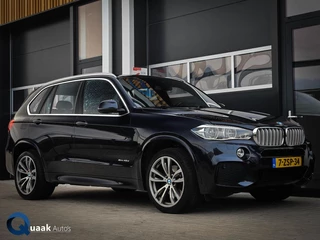 Hoofdafbeelding BMW X5 BMW X5 40D xDrive M-Sport | HUD | COMFORTZETELS | PANO | LED | CARBONSCHWARZ METTALIC | TREKHAAK | MEMORY