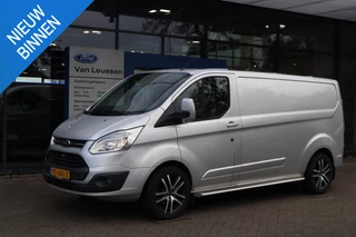 Ford Transit Custom 290 2.2 TDCI L2H1 LIMITED 3-PERSOONS TREKHAAK CAMERA P-SENSOREN STOELVERWARMING NAVI SIDEBARS LM-VELGEN BETIMMERD