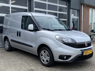 Hoofdafbeelding Fiat Doblò Fiat Doblò Cargo 1.3 MJ L1H1 SX 20x op voorraad Btw en Bpm vrij Airco Cruise controle Navigatie Tussenschot Parkeerhulp achter 1e eigenaar Ex overheid Euro 5 Marge