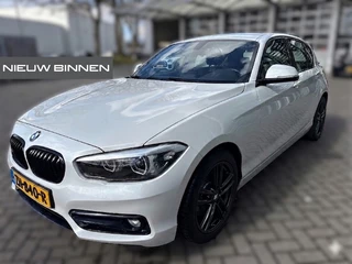 BMW 1 Serie 118i Sport Line Edition | Stoelverwarming | Cruise Control | Parkeersensoren | Navigatie | Groot Scherm | Digitale Tellers | Automaat | Keyless | Trekhaak | LED