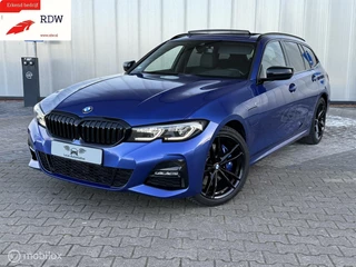 Hoofdafbeelding BMW 3 Serie BMW 330e Touring M-Sport High Exe Pano/ HUD/ Laser/ Trekhaak