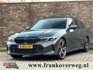 Hoofdafbeelding BMW 3 Serie BMW 3 Serie 320E M-Sport Pro Pakket Panodak 19 Inch Trekhaak Leer Head-Up