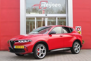 Alfa Romeo Tonale PHEV 280PK VELOCE | HARMAN/KARDON PREMIUM AUDIO | PREMIUM PACK: LEDEREN BEKLEDING/GEVENTILEERDE VOORSTOELEN/4-VOUDIG ELEKTRISCH VERSTELBARE LENDESTEUN VOORSTOELEN | WINTERPACK: STOEL/STUUR VERWARMING | STOEL VENTILATIE | TECHNOLOGY PACK: PARKEERWAARSCHUWING VOOR EN ACHTER/360° CAMERA/AUTOMATISCH INPARKEREN/ AUTONOMOUS DRIVING LEVEL 2: ADAPTIVE CRUISE CONTROL/LANE CENTERING ASSIST/TRAFFIC JAM ASSIST DODEHOEK DETECTIE AUTOMATISCH DIMMENDE BUITENSPIEGELS | DRAADLOZE TELEFOONLADER | FULL LED MATRIX KOPLAMPEN | DUAL STAGE VALVE: ACTIEVE DEMPING | KEYLESS ENTRY/START | 20" LICHTMETALEN VELGEN | ROODGESPOTEN BREMBO REMKLAUWEN | NAVIGATIE | DRAADLOZE APPLE CARPLAY/ANDROID AUTO | ELEKTRISCH BEDIENBARE ACHTERKLEP |