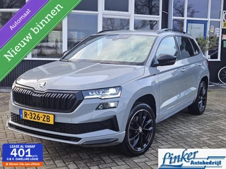 Skoda Karoq 1.5 TSI ACT Sportline Business DSG TREKH NL-AUTO ACHTERBANK VERWARMING