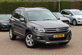 Volkswagen Tiguan 2.0 TSI Sport&Style 4Motion / Trekhaak / Android Auto / Parkeerhulp V+A / 17'' / Xenon / DAB / Navigatie / Stoelverwarming / Cruise Control