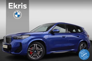 BMW iX1 eDrive20 67 kWh M Sportpakket Pro/ Stuurwielverwarming/ Comfort Access/ Elektrische Trekhaak/ Achteruitrijcamera/ panoramadak/ Harman-Kardon