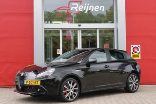 Hoofdafbeelding Alfa Romeo Giulietta Alfa Romeo Giulietta 1.4 120PK TURBO SPRINT | LEDEREN BEKLEDING | AFNEEMBARE TREHAAK | ALL SEASON BANDEN | NAVIGATIE | CLIMATE CONTROL | CRUISE CONTROL | CARBON INTERIEUR AFWERKING | 18" LICHTMETALEN VELGEN | DAB+ RADIO | PARKEER SENSOREN |