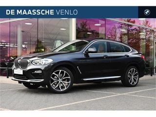 Hoofdafbeelding BMW X4 BMW X4 xDrive20i High Executive xLine Automaat / Trekhaak / Panoramadak / Sportstoelen / M Sportonderstel / LED / Parking Assistant Plus / Stoelverwarming / Navigatiesysteem Professional