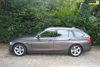 BMW 3-serie Touring 328i High Exe trekhaak/memory/camera