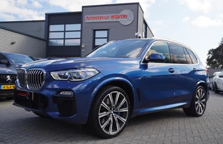 Hoofdafbeelding BMW X5 BMW X5 XDrive40i High Executive | M-pakket | HuD | Adaptieve Cruise | Panorama | Elek. trekhaak | Assisted Driving | Lane Assist |