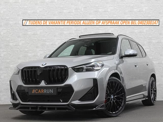 BMW X1 18i M-Sport Performance-Pack | Panorama | Sportstoelen | Carbon | Keyless-Entry | Sfeerverlichting | Achteruitrij-Camera | 5x op voorraad | Carplay | Full-LED | Black-Optic | Getint Glas | Stoelverwarming | Draadloos Laden |