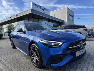 Hoofdafbeelding Mercedes-Benz C-Klasse Mercedes-Benz C-Klasse Estate 300 e 4MATIC AMG Night Pano-Dak | Distronic | Leer | Massage | HUD |