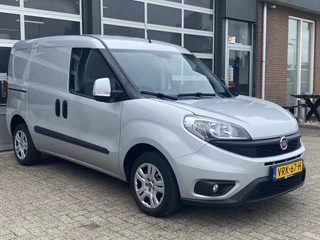 Hoofdafbeelding Fiat Doblò Fiat Doblò Cargo 1.3 MJ L1H1 SX Marge Btw en Bpm vrij Airco Cruise controle Navigatie Tussenschot Parkeerhulp achter 1e eigenaar Ex overheid Euro 5 Marge 20x op voorraad