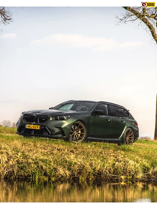 Hoofdafbeelding BMW M5 BMW M5 Touring keramisch pano trekh NL-auto M Driv.Pack 22"