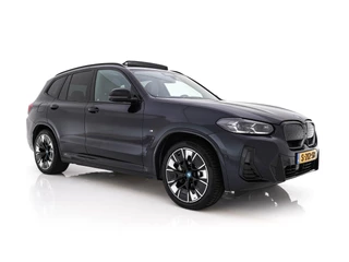 Hoofdafbeelding BMW iX3 BMW iX3 High Executive 80 kWh Facelift [ 3-Fase-11kW) ] {SOH-100%} (INCL-BTW) Aut. *PANO | LEATHER | ADAPTIVE-CRUISE | FULL-LED | HARMAN/KARDON | TOPVIEW | MEMORY-PACK | BLINDSPOT | DIGI-COCKPIT | HEATED-COMFORTSEATS | DAB+ | NAVI-FULLMAP | HEAD-UP | 20''ALU