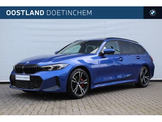 Hoofdafbeelding BMW 3 Serie BMW 3 Serie Touring 320i High Executive M Sport Automaat / Panoramadak / Trekhaak / Sportstoelen / M Sportonderstel / Comfort Access / Adaptieve LED / Parking Assistant Plus