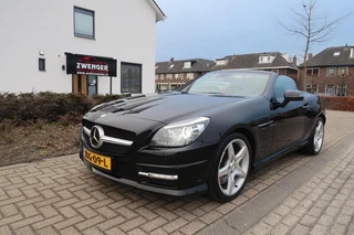 Hoofdafbeelding Mercedes-Benz SLK Mercedes SLK-klasse 250 Aut AMG|PANORAMADAK|ADAPTIVE CRUISECONTROL|HARMAN-KARDON|RODE-GORDELS|NAVIGATIE|PERFECT ONDERHOUDEN