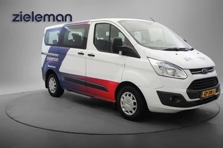 Hoofdafbeelding Ford Tourneo Custom Ford Tourneo Custom 2.2 TDCI L1H1 9 Persoons - Navi, Cruise, Trekhaak