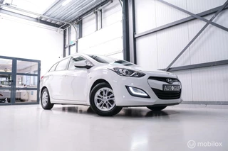 Hoofdafbeelding Hyundai i30 Hyundai i30 Wagon 1.6 GDI 120 pk | Trekhaak | Clima | Cruise | Stuurwielverwarming | All seasons | Nieuwe APK |