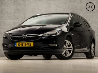 Opel Astra Sports Tourer 1.4 Innovation Deluxe 150Pk Automaat (APPLE CARPLAY, GROOT NAVI, STUUR/STOELVERWARMING, CAMERA, LEDEREN SPORTSTOELEN, ADAPTIVE CRUISE, KEYLESS, GETINT GLAS, NIEUWSTAAT)