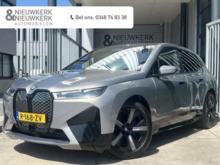 Hoofdafbeelding BMW iX BMW iX xDrive40 High Executive 77 kWh | SOH 98% | VOL! | PANORAMADAK | LEDER | HEAD-UP DISPLAY | HARMAN/KARDON | 360 CAMERA | ADAPTIVE CRUISE CONTROL | LMV 21" | CARPLAY/ANDROID | ELKTR. MEMORY STOELEN | NAVI | STOEL/STUURVERWARMING & VERKOELING | ACHTERBANK VER