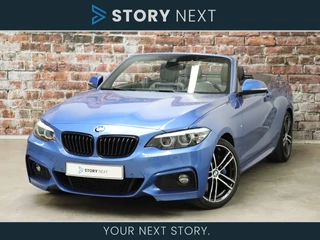 BMW 2 Serie Cabrio 220i High Executive M Sport Pakket Automaat / Harman Kardon / Achteruitrijcamera / M Sportremsysteem / DAB / Stoelverwarming / Shadow Line / Cruise Control / Sportstoelen / Leder / 18 Inch / Navigatie Professional