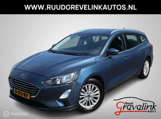 Hoofdafbeelding Ford Focus Ford Focus Wagon 125 PK H6 Titanium Navigatie Trekhaak Clima Chroom Carplay Full Led