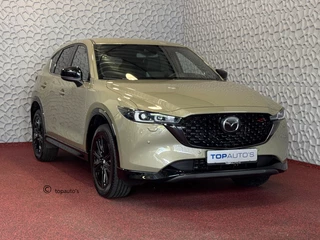 Hoofdafbeelding Mazda CX-5 Mazda CX-5 2.0 E SkyActiv MHEV 165 HOMURA LEER/ALCANTARA ELEK.KLEP ADAP.CRUISE 19''LMV HEAD-UP 360.CAMERA FULL LED CARPLAY NAVI STOEL/STUUR VERW. BOSE 09/2024