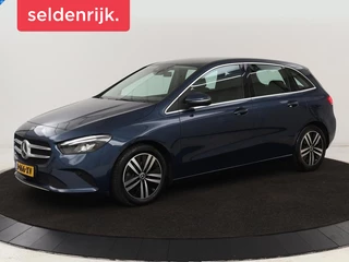 Mercedes-Benz B-klasse 180 Business Solution Luxury | Leder | Trekhaak |  Stoelverwarming | Camera | Navigatie | Full LED | Park Assist | Sfeerverlichting | Widescreen