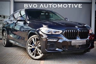 Hoofdafbeelding BMW X6 BMW X6 M50i High Executive 4W Sturing Pano Sky Soft-Close Trekhaak HUD