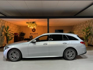 Hoofdafbeelding Mercedes-Benz C-Klasse Mercedes-Benz C-klasse Estate 300 e AMG Line Garantie Trekhaak Massage Pano Ambient 360 Blindspot Elek Achterklep StoelVW Rijklaar