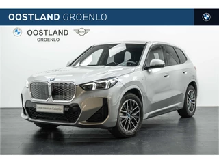Hoofdafbeelding BMW iX1 BMW iX1 eDrive20 M Sport / Sportstoelen / Comfort Access / Achteruitrijcamera / Adaptieve Cruise Control / Stoelverwarming / Getint glas