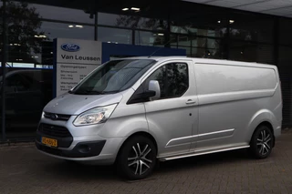 Ford Transit Custom 290 2.2 TDCI L2H1 LIMITED 3-PERSOONS TREKHAAK CAMERA P-SENSOREN STOELVERWARMING NAVI SIDEBARS LM-VELGEN BETIMMERD
